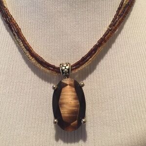 Brown stone pendant on beaded strands